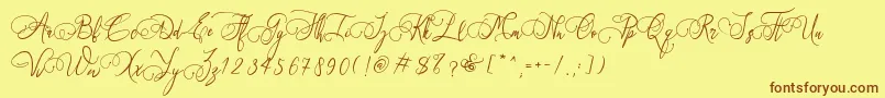 Art Maria Font – Brown Fonts on Yellow Background