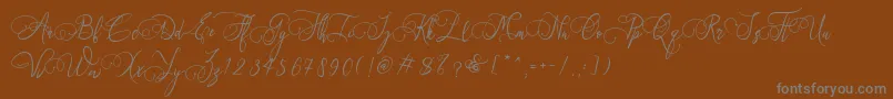 Art Maria Font – Gray Fonts on Brown Background