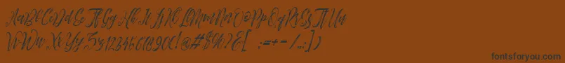 Arthands Font – Black Fonts on Brown Background