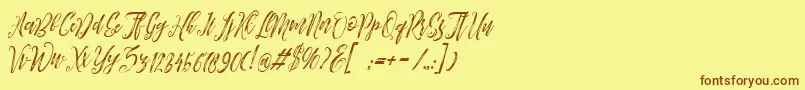 フォントArthands – 茶色の文字が黄色の背景にあります。