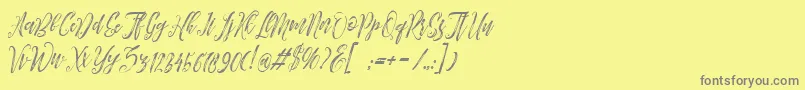 Arthands-fontti – harmaat kirjasimet keltaisella taustalla