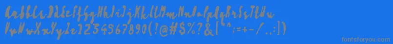 Artisoya Three-fontti – harmaat kirjasimet sinisellä taustalla