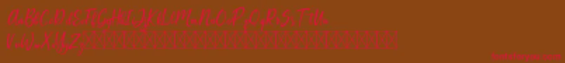 Artopyl Demo-Schriftart – Rote Schriften auf braunem Hintergrund