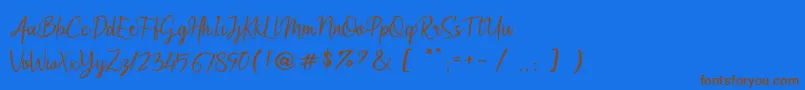 フォントArumdalu – 茶色の文字が青い背景にあります。