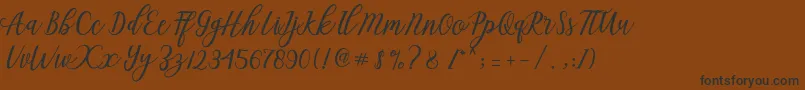 Aseline Script Font – Black Fonts on Brown Background