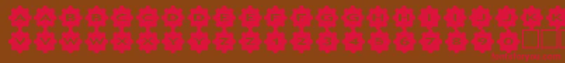 フォントasgears3 – 赤い文字が茶色の背景にあります。