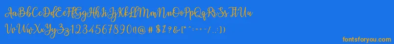 フォントAshadiya – オレンジ色の文字が青い背景にあります。