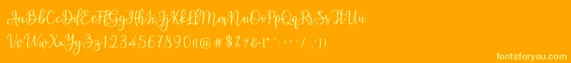 Ashadiya-Schriftart – Gelbe Schriften auf orangefarbenem Hintergrund
