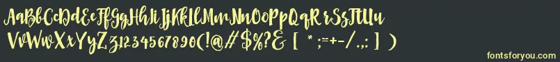 Asly Brush Font – Yellow Fonts on Black Background