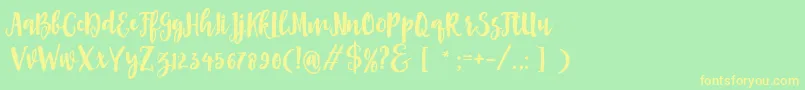 Asly Brush Font – Yellow Fonts on Green Background