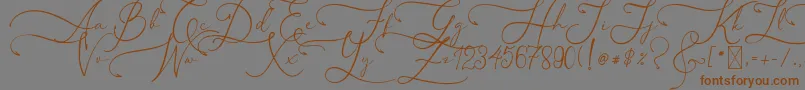 フォントAsmelinaHarley – 茶色の文字が灰色の背景にあります。