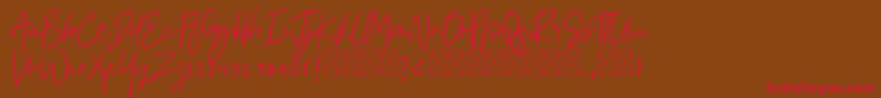 Asmudila Font – Red Fonts on Brown Background