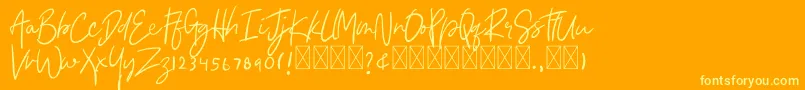 Asmudila Font – Yellow Fonts on Orange Background