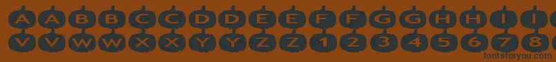 aspumpkins-Schriftart – Schwarze Schriften auf braunem Hintergrund