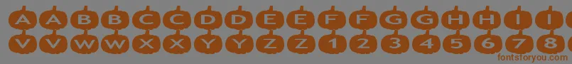 フォントaspumpkins – 茶色の文字が灰色の背景にあります。