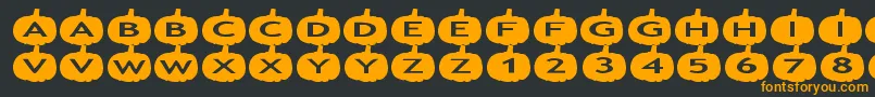 フォントaspumpkins – 黒い背景にオレンジの文字