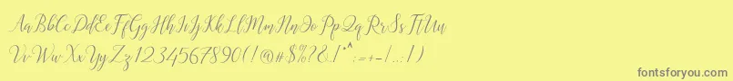 フォントAstereiska – 黄色の背景に灰色の文字