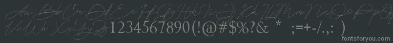 Astina-fontti – harmaat kirjasimet mustalla taustalla