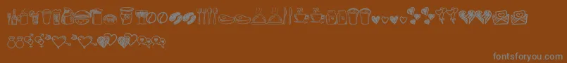 Czcionka Astrokids Doodle – szare czcionki na brązowym tle
