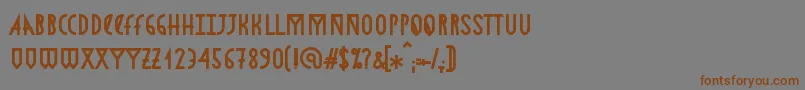 フォントAstronmicaBold – 茶色の文字が灰色の背景にあります。