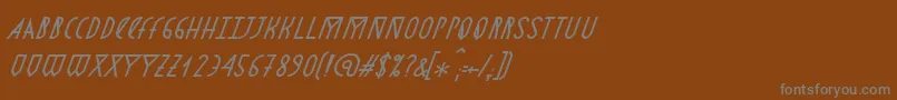 AstronmicaItalic-fontti – harmaat kirjasimet ruskealla taustalla
