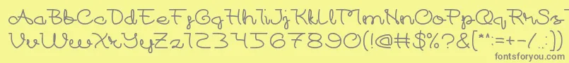 フォントAt Most Sphere – 黄色の背景に灰色の文字