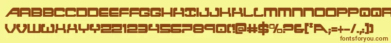 フォントatlantiacond – 茶色の文字が黄色の背景にあります。