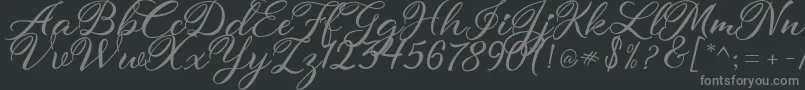 atmaka-fontti – harmaat kirjasimet mustalla taustalla