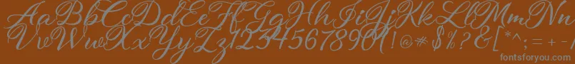 atmaka Font – Gray Fonts on Brown Background