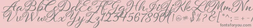 atmaka-fontti – harmaat kirjasimet vaaleanpunaisella taustalla