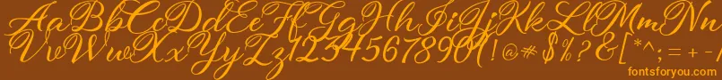 atmaka Font – Orange Fonts on Brown Background