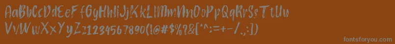 フォントAtokous – 茶色の背景に灰色の文字