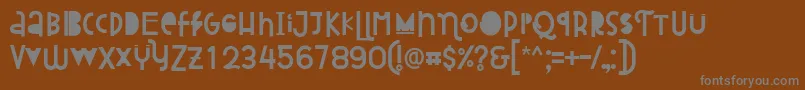 Attracted Monday Regular-fontti – harmaat kirjasimet ruskealla taustalla