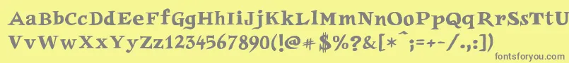 フォントAuca – 黄色の背景に灰色の文字