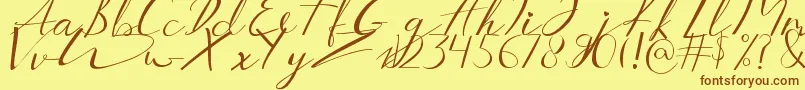 Aucklands Script Font – Brown Fonts on Yellow Background