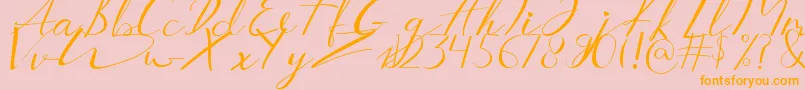 フォントAucklands Script – オレンジの文字がピンクの背景にあります。