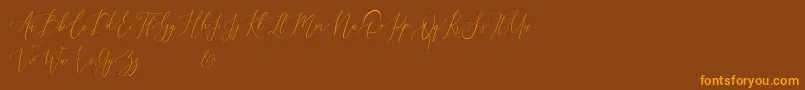 Audrey and Reynold Demo-Schriftart – Orangefarbene Schriften auf braunem Hintergrund