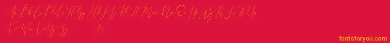 Audrey and Reynold Demo-Schriftart – Orangefarbene Schriften auf rotem Hintergrund