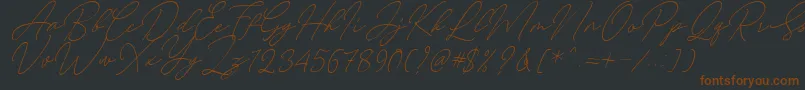 Czcionka August Script Bold Free – brązowe czcionki na czarnym tle