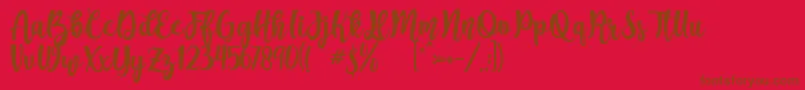 Fonte Augustha demo – fontes marrons em um fundo vermelho