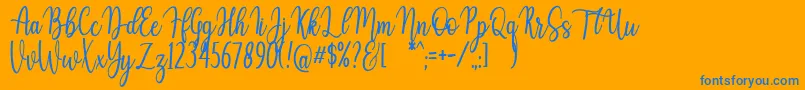 Auristela Script-Schriftart – Blaue Schriften auf orangefarbenem Hintergrund