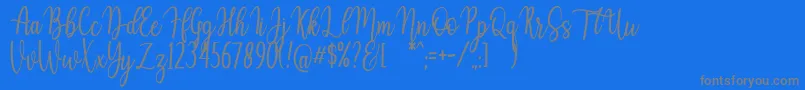 Auristela Script-Schriftart – Graue Schriften auf blauem Hintergrund