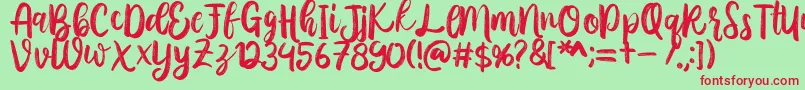 Austhina Brush Calligraphy Scratch -Schriftart – Rote Schriften auf grünem Hintergrund