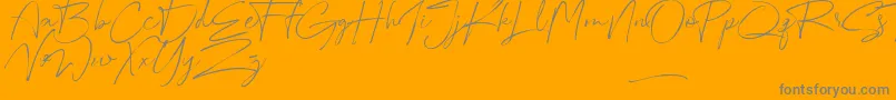 Australia Script-Schriftart – Graue Schriften auf orangefarbenem Hintergrund