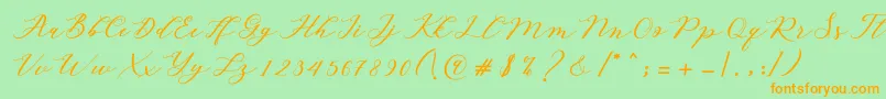 Autines Script-Schriftart – Orangefarbene Schriften auf grünem Hintergrund