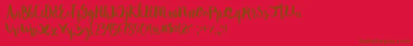 Autodidact Font – Brown Fonts on Red Background