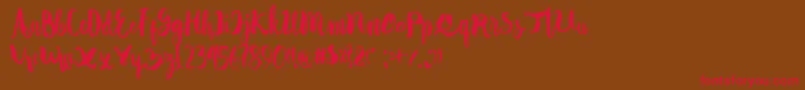 Autodidact Font – Red Fonts on Brown Background