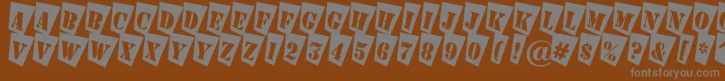 AStampercmtw Font – Gray Fonts on Brown Background
