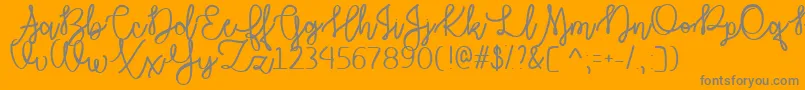 Autumn Moon  -Schriftart – Graue Schriften auf orangefarbenem Hintergrund