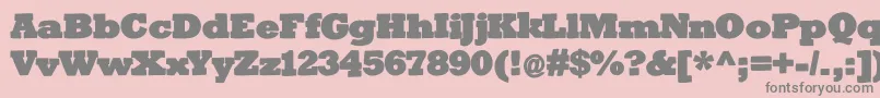 Bigslabhammer-fontti – harmaat kirjasimet vaaleanpunaisella taustalla